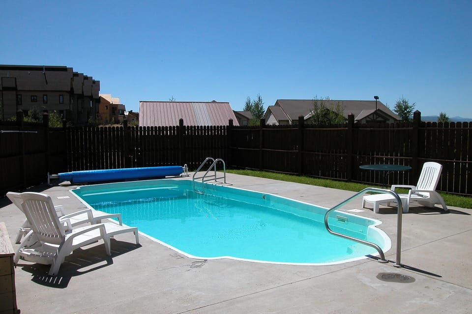 Dive into your private oasis! This sparkling pool awaits your morning laps and afternoon lounging sessions.