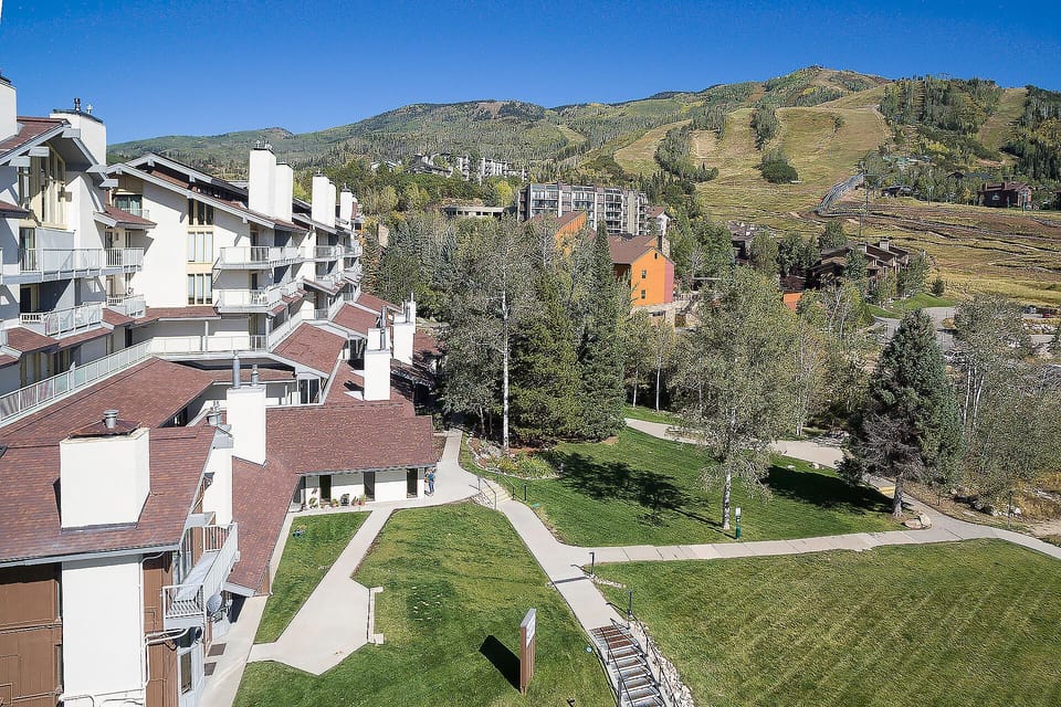 A mountain resort neighborhood nestled at the base of pristine ski slopes, featuring manicured grounds and convenient access to outdoor adventures year-round.