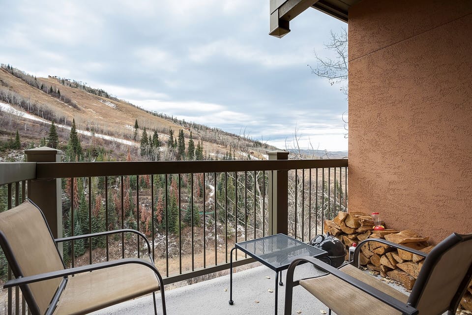 Step onto your private balcony and breathe in crisp mountain air while taking in sweeping views of snow-dusted peaks and forested valleys.