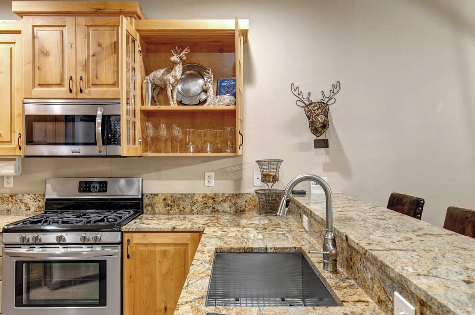Your fully equipped kitchen features granite countertops, stainless steel appliances, and charming rustic touches that make meal prep feel like home.