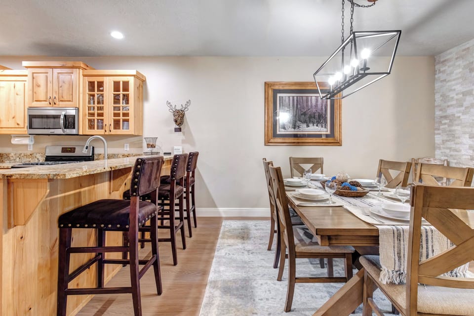 Gather around warm wood tones and granite countertops in your spacious kitchen and dining area, perfect for sharing meals and making memories with loved ones.