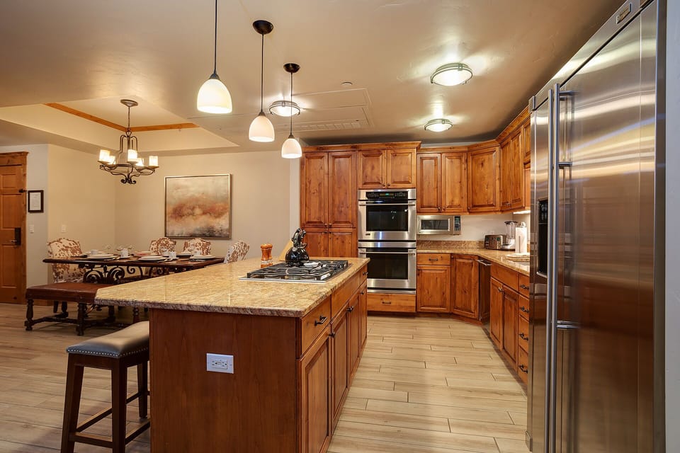 Your gourmet kitchen awaits with rich wood cabinetry, granite counters, and professional-grade stainless appliances for memorable culinary adventures.