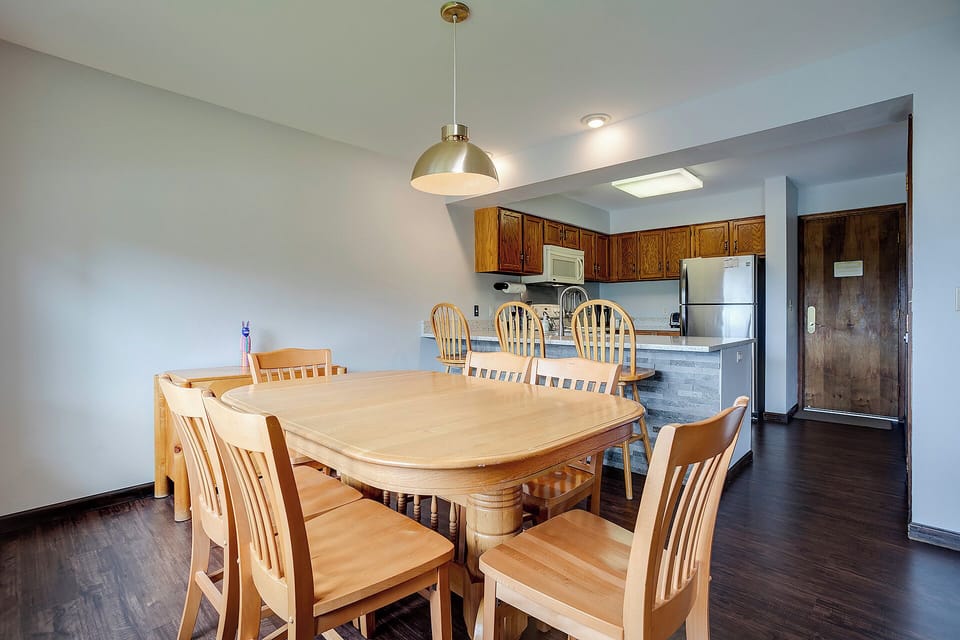 Gather around your spacious dining table for memorable meals, with a fully equipped kitchen ready for your culinary adventures.