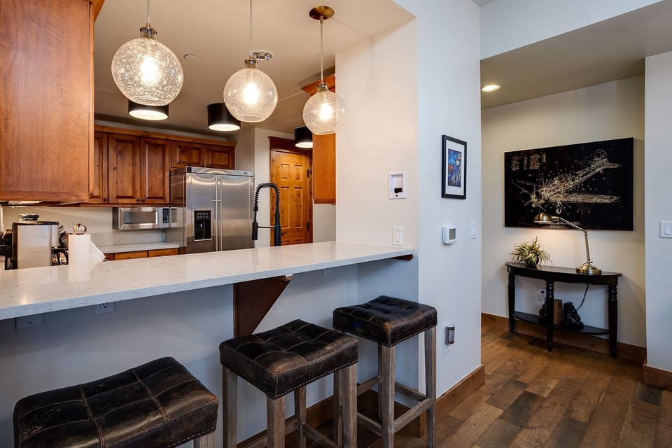 You'll love cooking in this modern kitchen with granite counters, pendant lighting, and a convenient breakfast bar for casual dining.