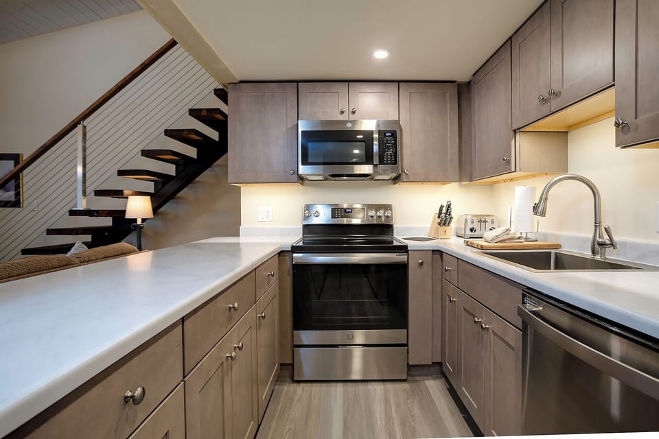 Your sleek kitchen features modern appliances and ample counter space for preparing meals during your stay.
