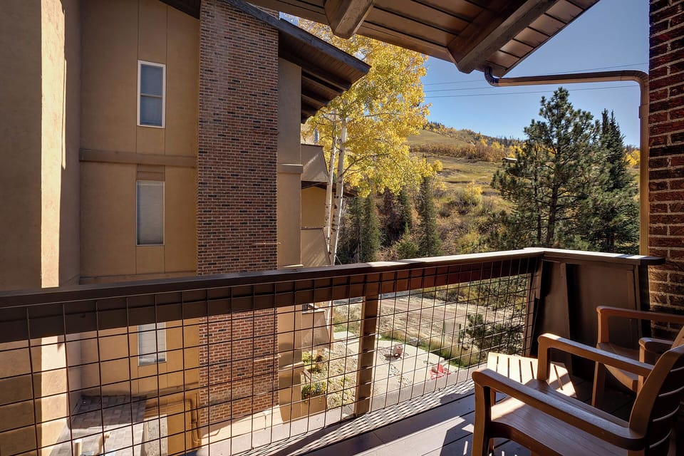 Step onto your private balcony and soak in stunning mountain vistas framed by golden autumn foliage, perfect for morning coffee moments.