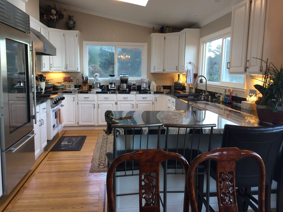 Large kitchen with subzero refrigerator and professional Viking gas stove/oven 