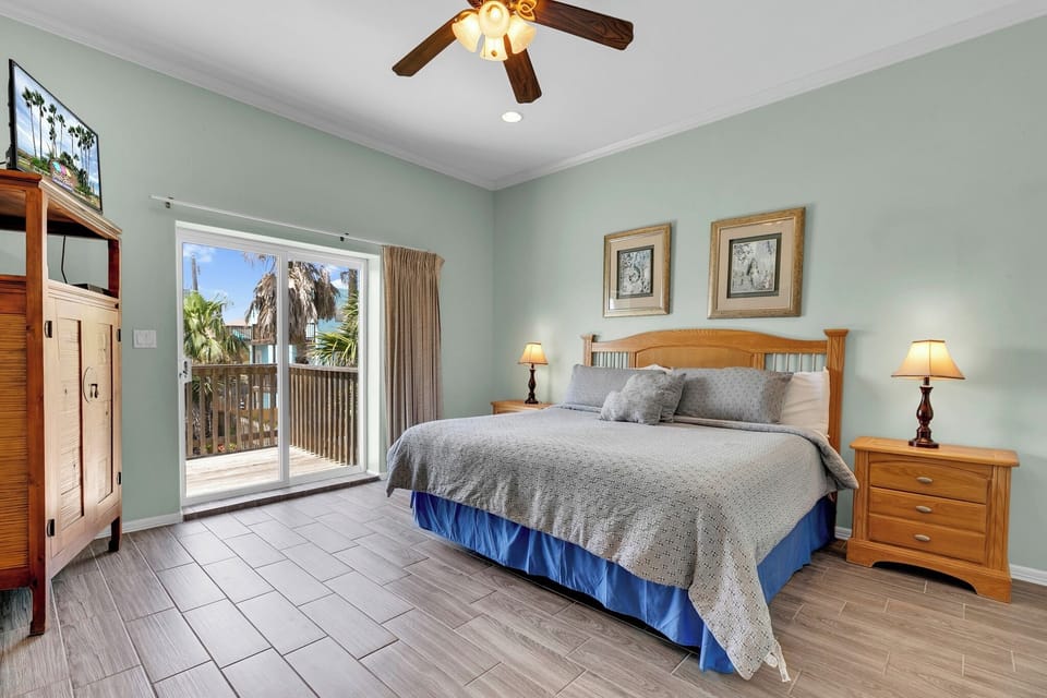 Master Bedroom with private balcony overlooking the pool.