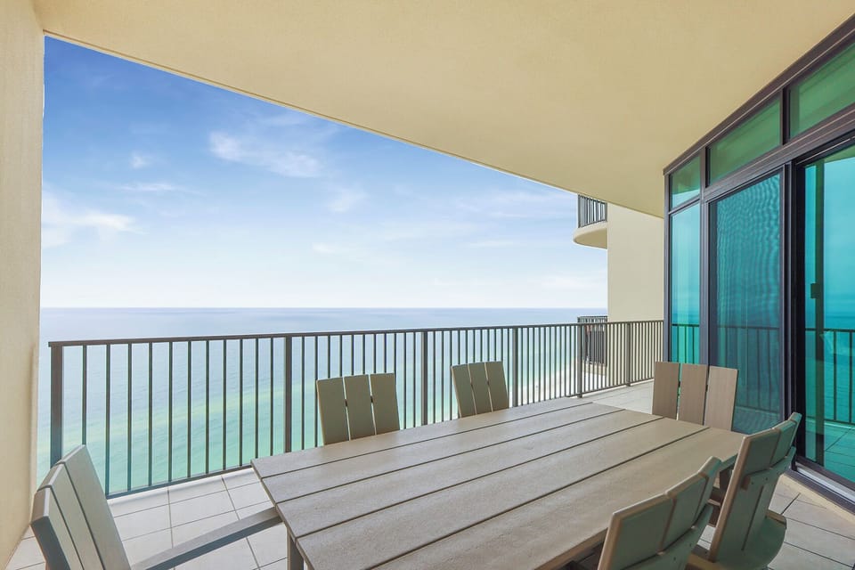 Relax at your balcony table as you soak in the breathtaking coastal views from your beach retreat