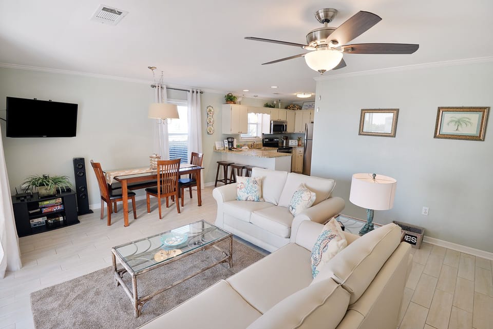 Open LR and Dining Room with smart TV and DVD player
