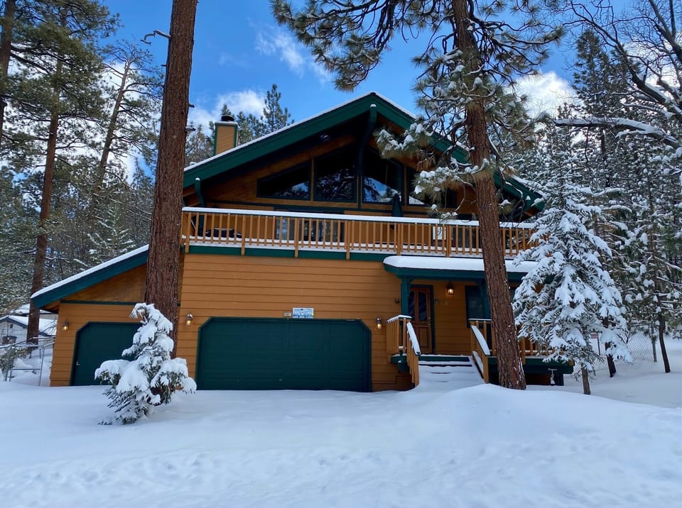 Snow covered Big Bear Cool Cabins, Summit Adventure