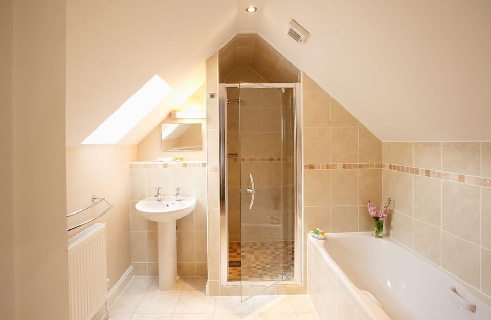 First floor:  En-suite bathroom with separate shower