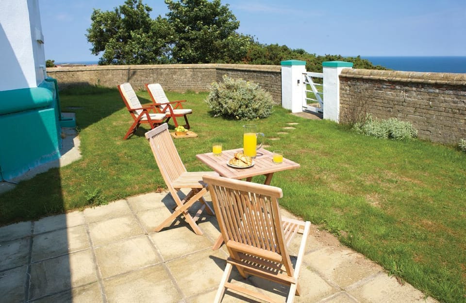 Rear walled garden with views of the sea, accessed externally via a separate gate