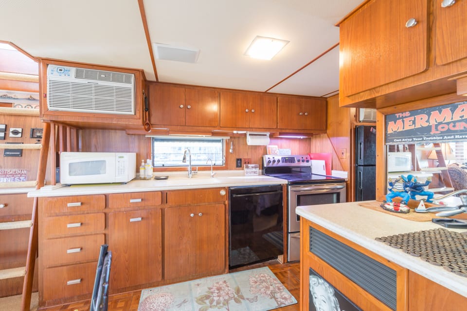 Kitchen area with full-size residential appliances.  