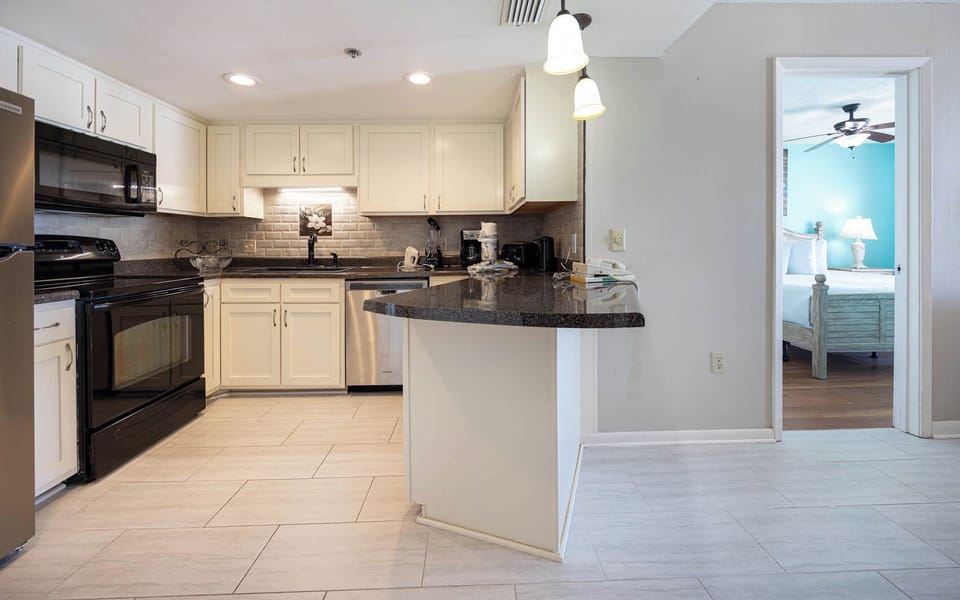 Cook and gather in this inviting kitchen with sleek appliances and elegant countertops