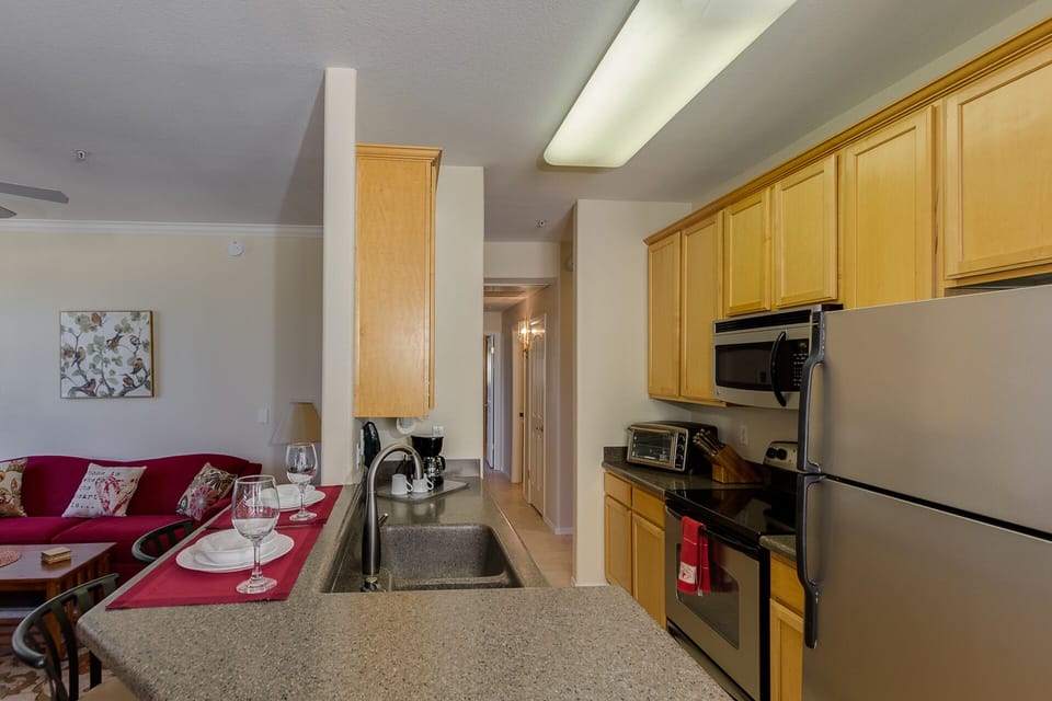 Kitchen with Corian Counters and Stainless Appliances