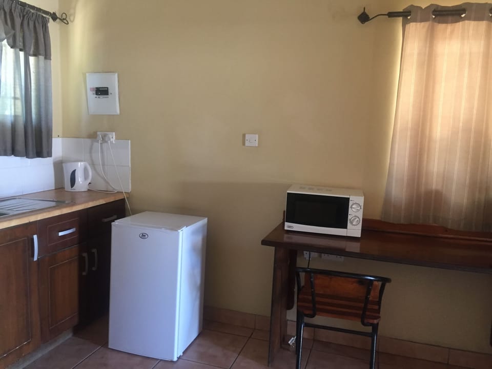 Luxury Chalet, Kitchenette, Garden View | Private kitchenette | Coffee/tea maker