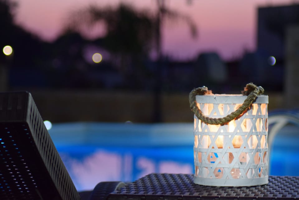 Outdoor pool, a rooftop pool, pool umbrellas, sun loungers