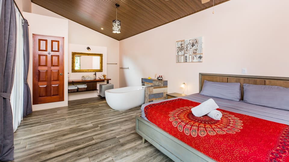 Deluxe Suite, 1 King Bed, Balcony | Deep soaking bathtub