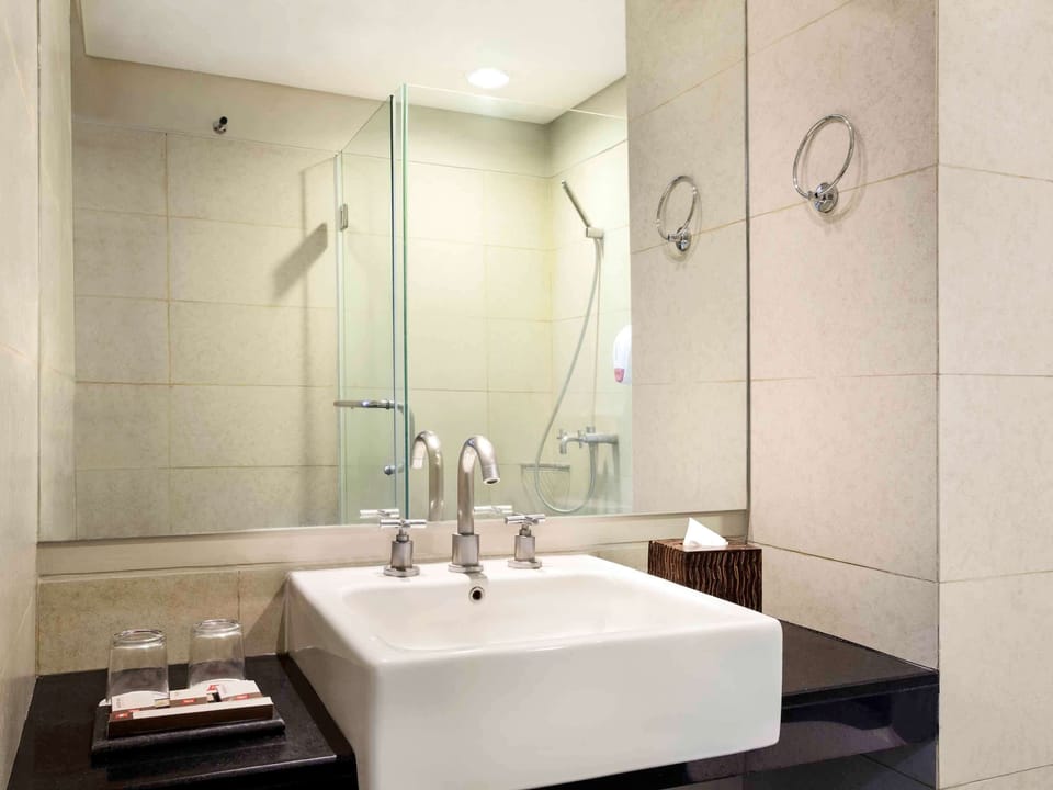 Shower, eco-friendly toiletries, hair dryer, slippers