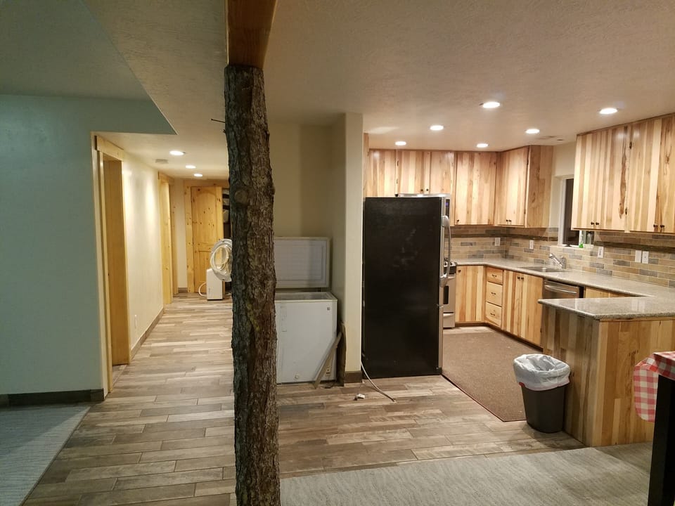 kitchen with  upright freezer, also pull out freezer in fridge. 