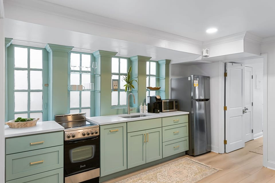 Updated kitchenette with full size fridge, slide in range, microwave, toaster oven, and single serve coffee maker
