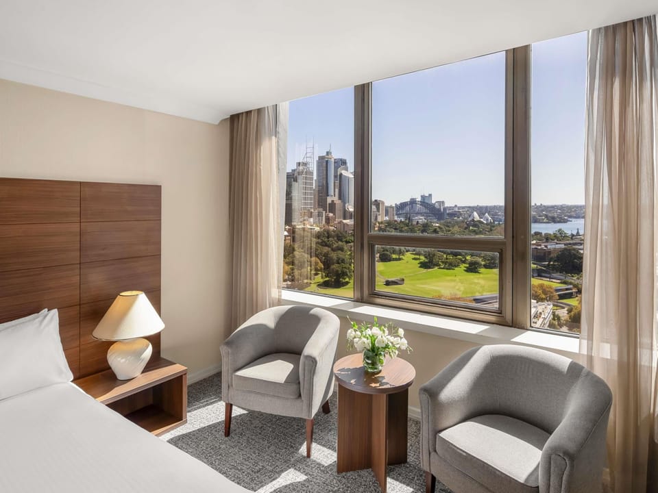 Deluxe Room, 1 King Bed, Harbor View | In-room safe, desk, iron/ironing board, free cribs/infant beds