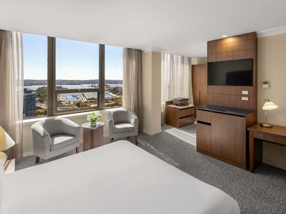 Deluxe Room, 1 King Bed, Harbor View | In-room safe, desk, iron/ironing board, free cribs/infant beds
