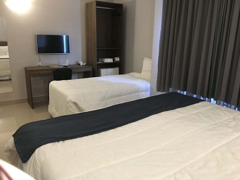 Standard Triple Room | Minibar, desk, iron/ironing board, free WiFi