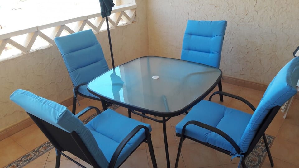 The lounge has a seating and dining area and leads into the balcony.