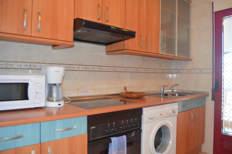 The fully equipped kitchen has all modern appliances and this leads to a utility area.