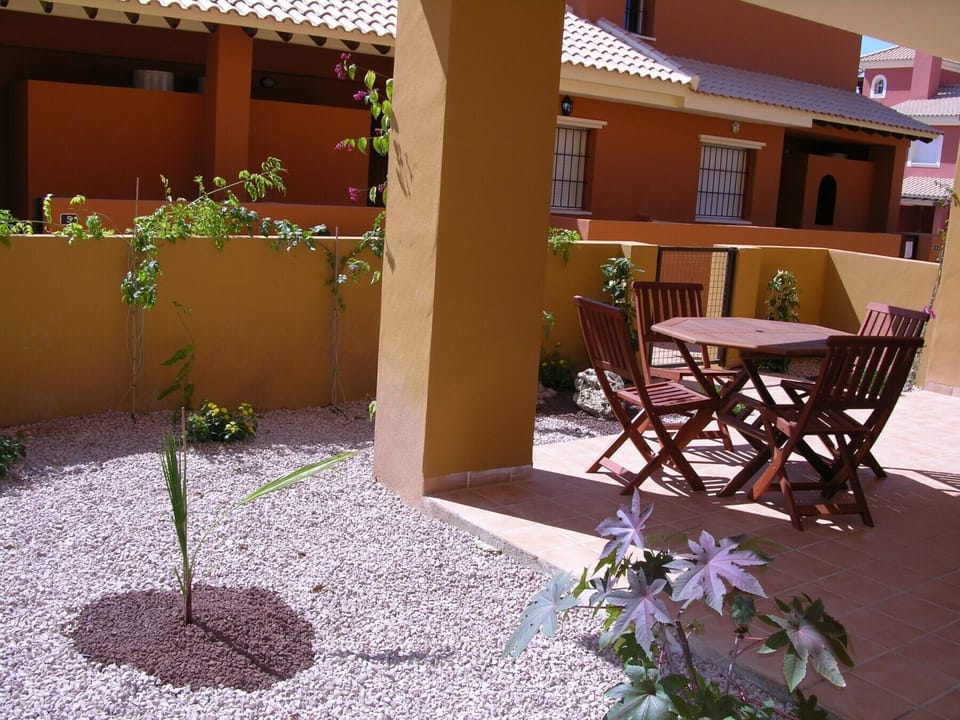 Private terrace equipped with chairs and table in apartment