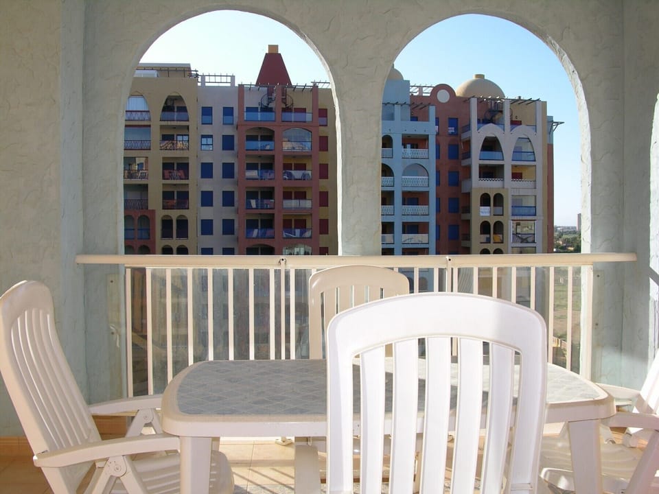 The lounge has a seating and dining area and leads into the balcony.