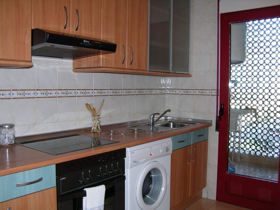The fully equipped kitchen has all modern appliances and this leads to a utility area.