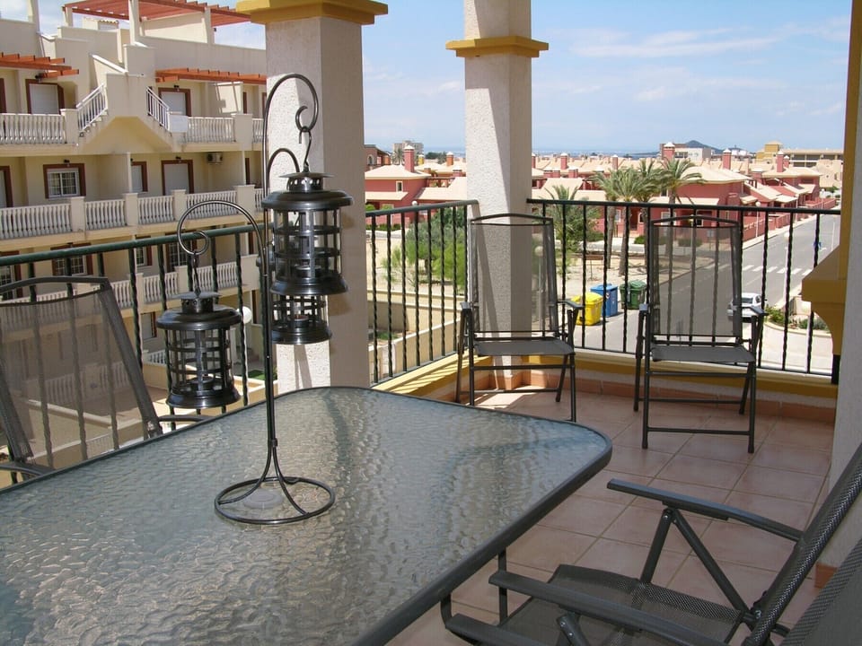 The lounge has a seating and dining area and leads into the balcony.