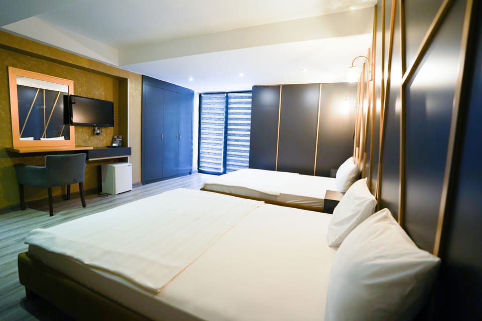 Family Quadruple Room | In-room safe, desk, laptop workspace, soundproofing
