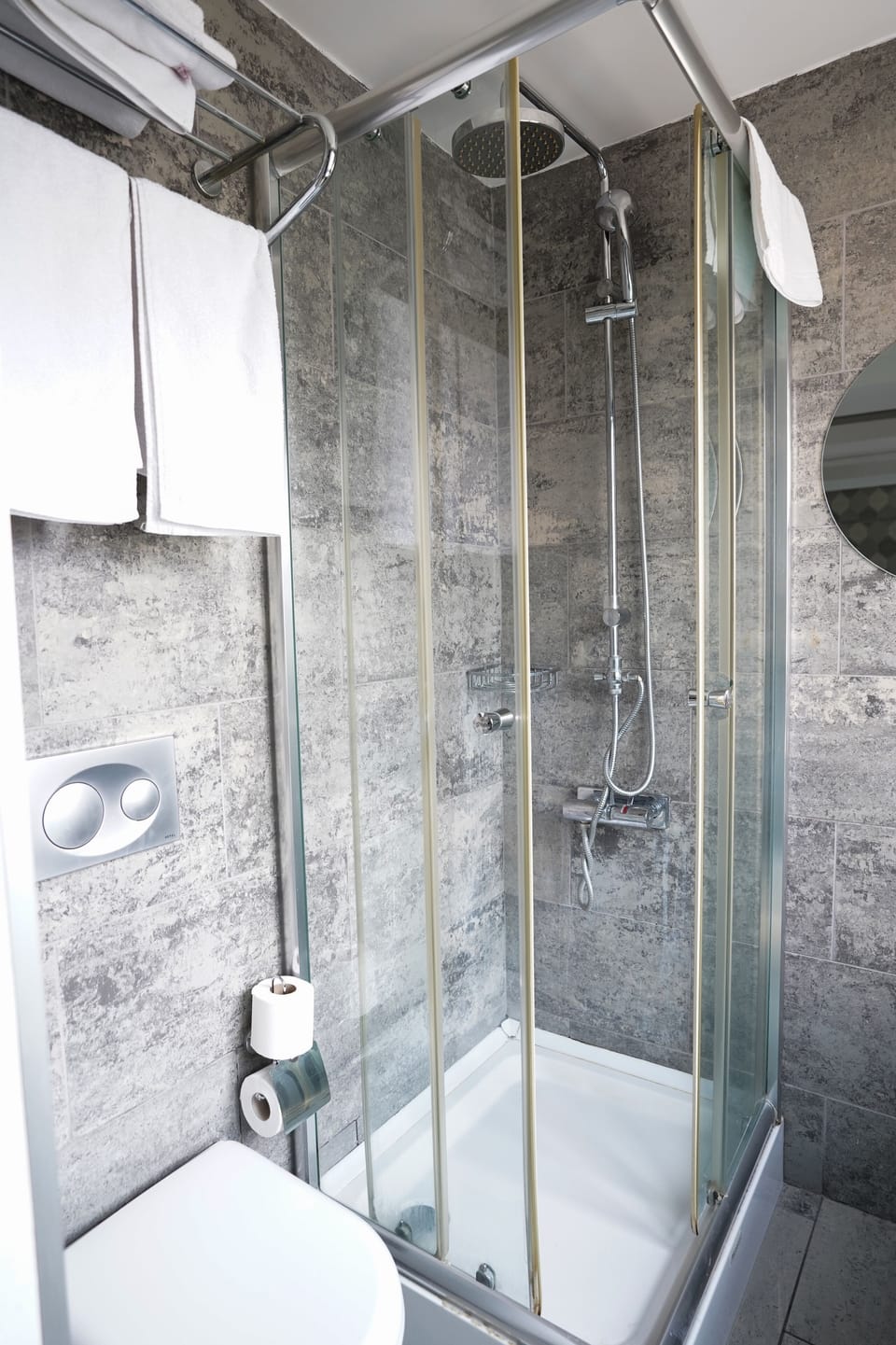 Shower, hair dryer, slippers, towels