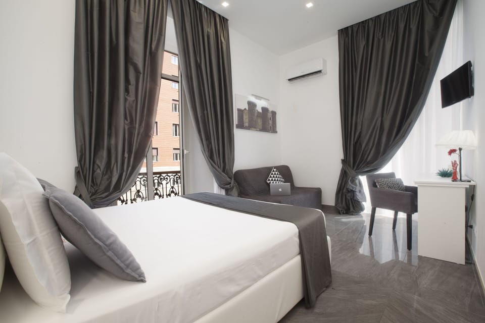 Deluxe Double Room, 1 Bedroom, City View | Minibar, in-room safe, desk, soundproofing
