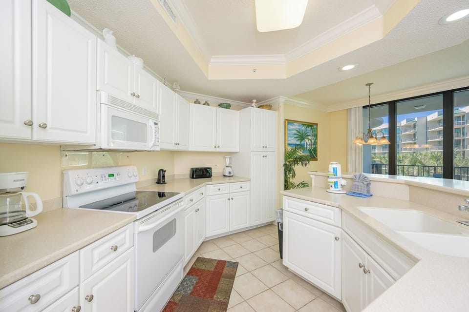 Create favorite dishes as sunlight streams in, enhancing your culinary adventures in this inviting kitchen space
