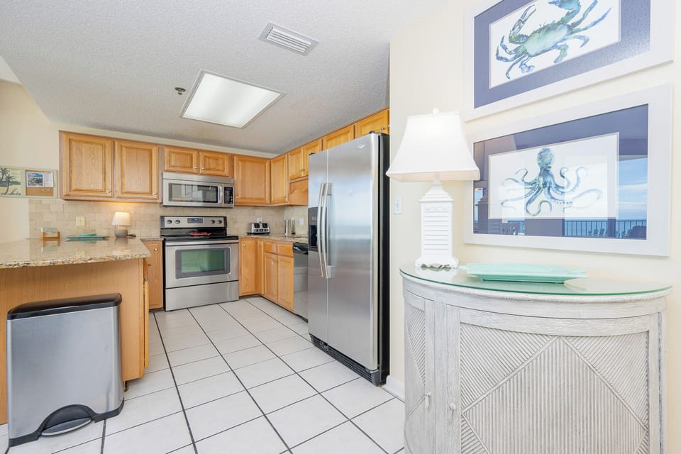 Warm wood cabinetry complements the sleek stainless appliances in this inviting kitchen area