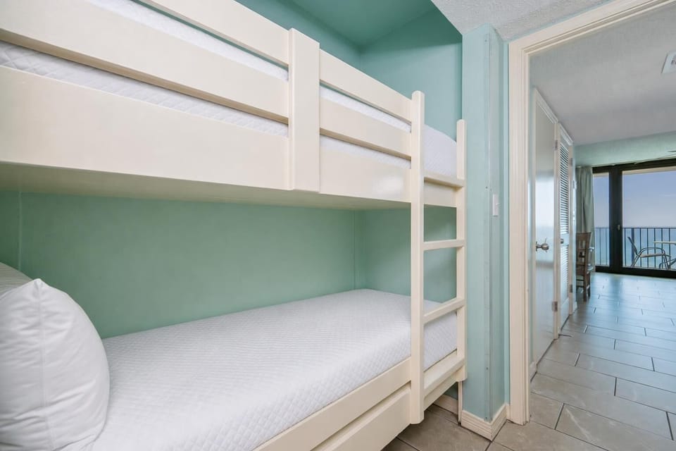Bunk beds in the hallway offer a cozy spot for the kids after fun-filled days along the coast