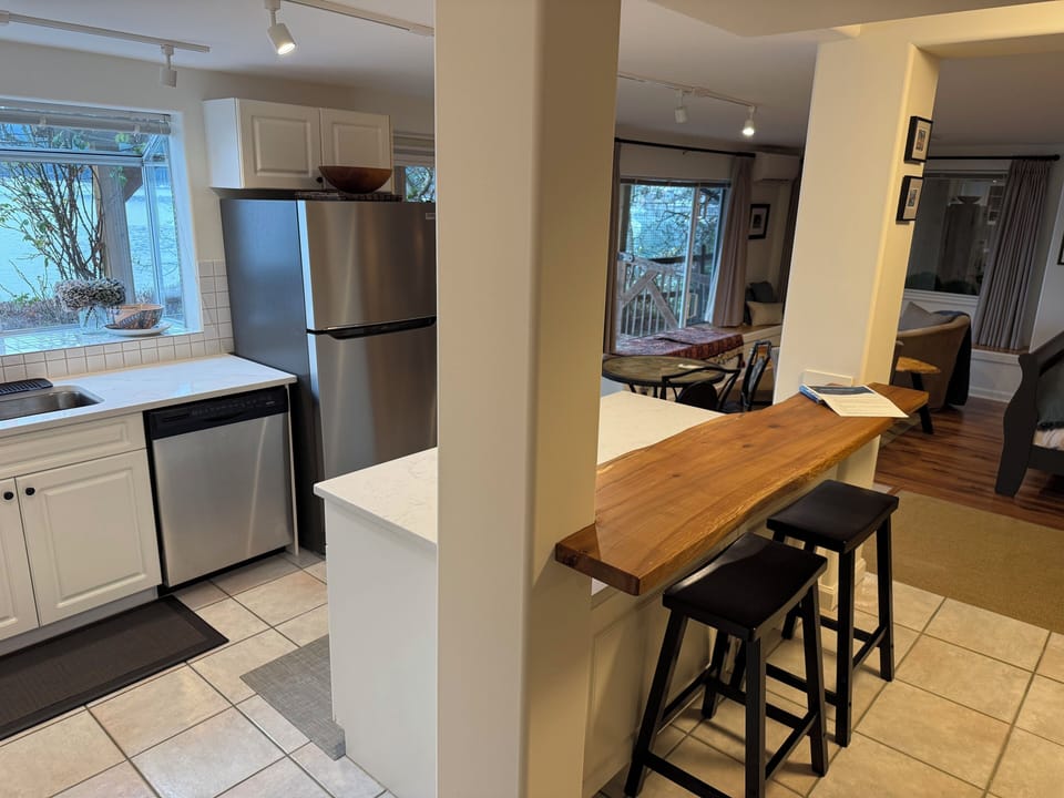 renovated kitchen with live edge bar seating