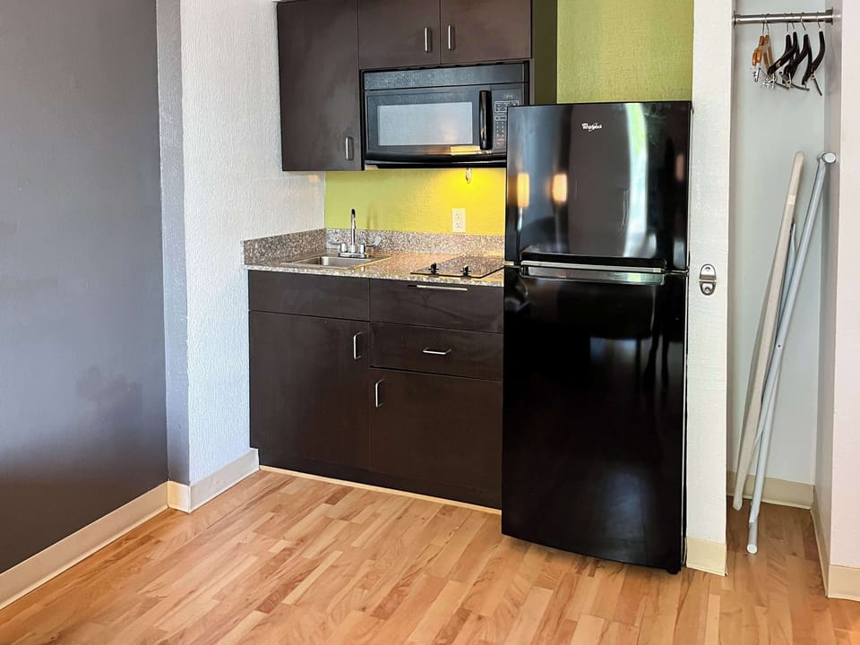 Full-size fridge, microwave, coffee/tea maker, dining tables
