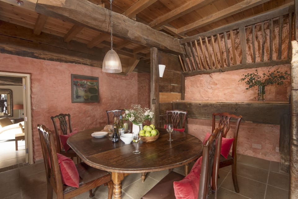 Dining area with table seating six guests