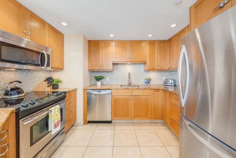 Functional kitchen with stainless steel appliances and wooden cabinets