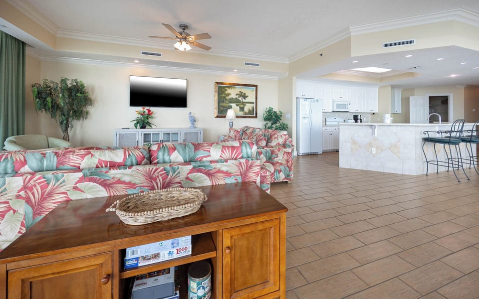 Gather in this welcoming living space and enjoy stunning beach views from the balcony