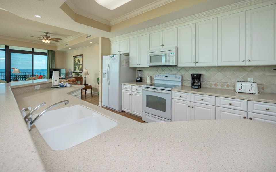 Experience culinary delights in this open kitchen to whip up favorite meals while enjoying coastal views