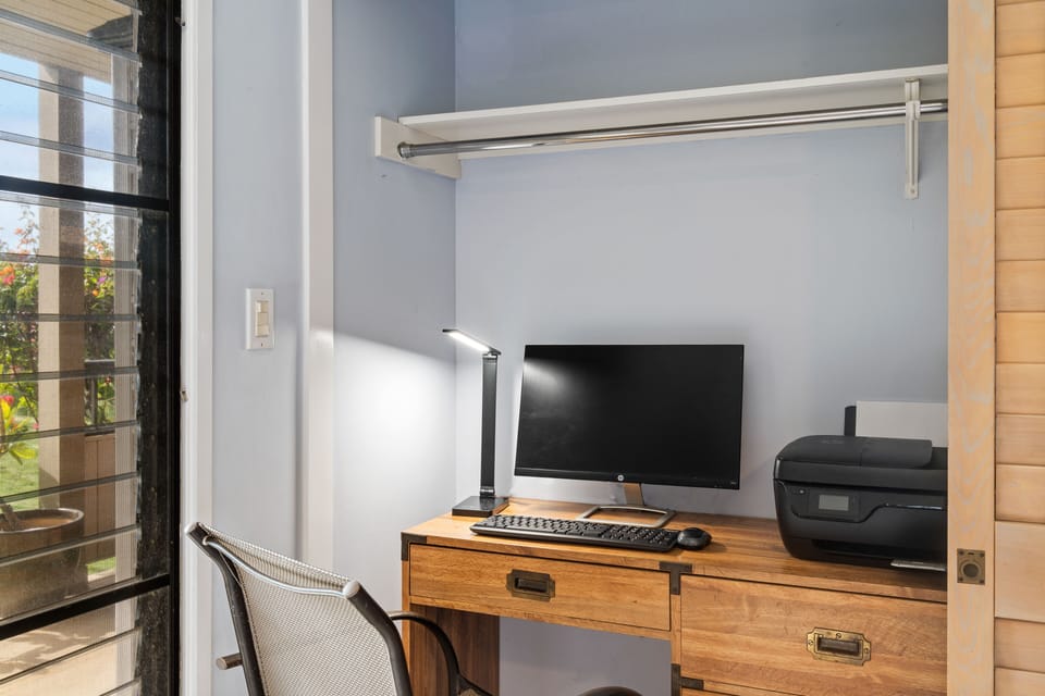 Work space with monitor, keyboard and air printer