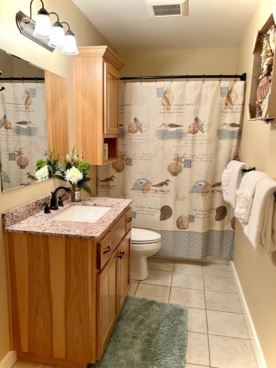 Main floor shares access to master bath with an entrance from the hallway.
