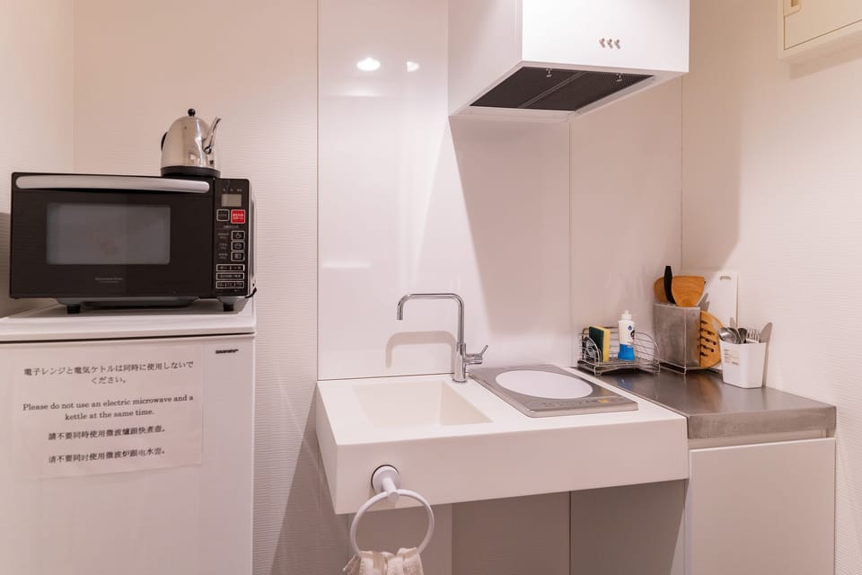Family Room (No Housekeeping During Stay) | Private kitchenette | Fridge, microwave, electric kettle, cookware/dishes/utensils